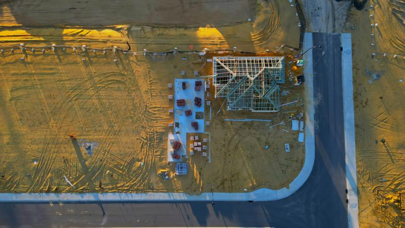 Aerial view of a house frame on a residential building site